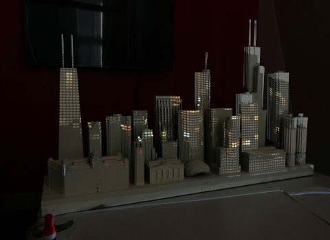 a die-cut model of the Chicago skyline