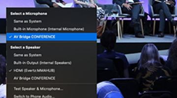 Screenshot of Zoom program showing recording of panel discussion on stage