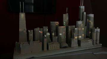 a die-cut model of the Chicago skyline